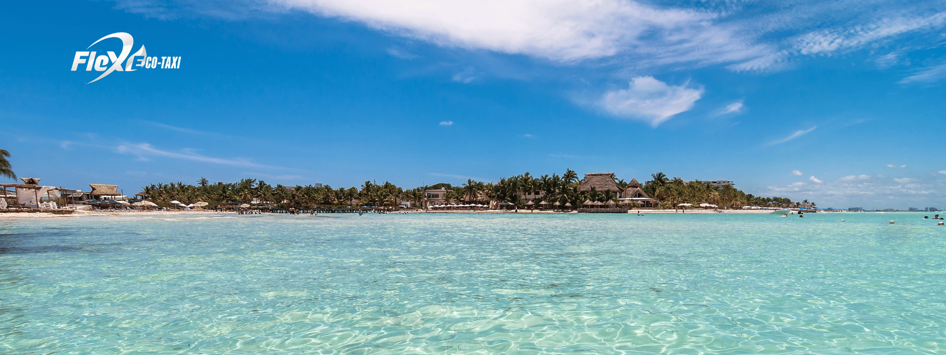 Crystal-clear shallow waters at Playa Norte on Isla Mujeres, ideal for families and swimming. Flex Eco Taxi can take you to the ferry for easy access.