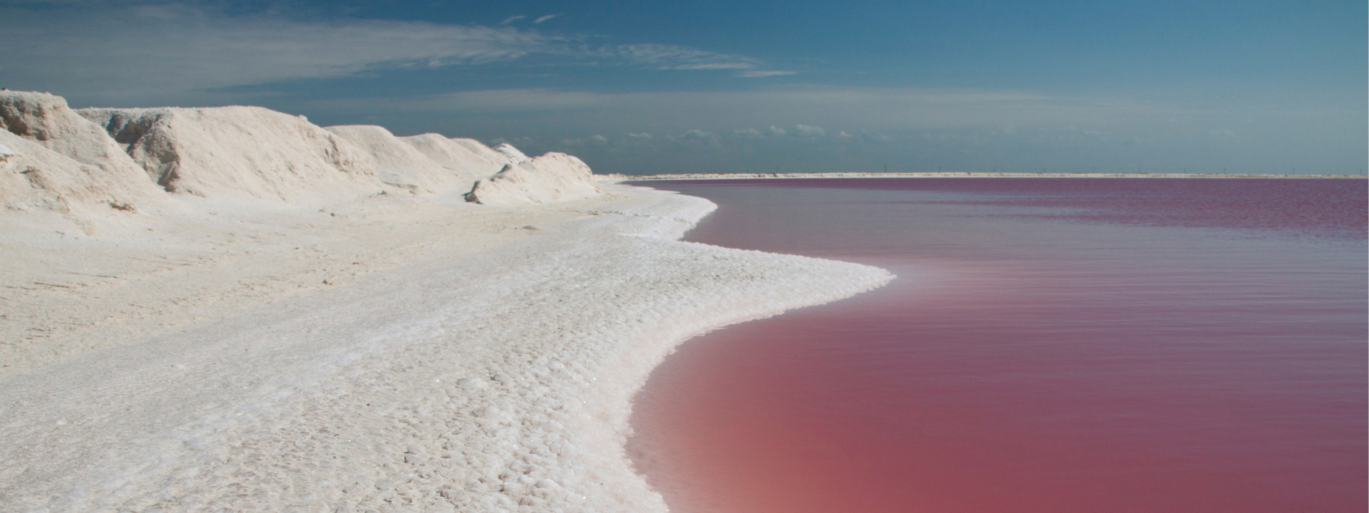 The striking pink waters of Las Coloradas, Yucatán, a breathtaking natural wonder in Mexico.