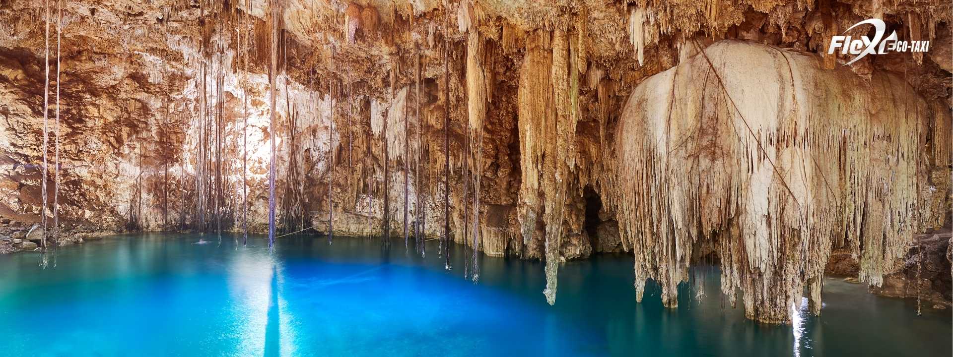 Exploring a cave cenote in Tulum, featuring stunning rock formations and turquoise waters. Travel stress-free with Flex Eco Taxi.