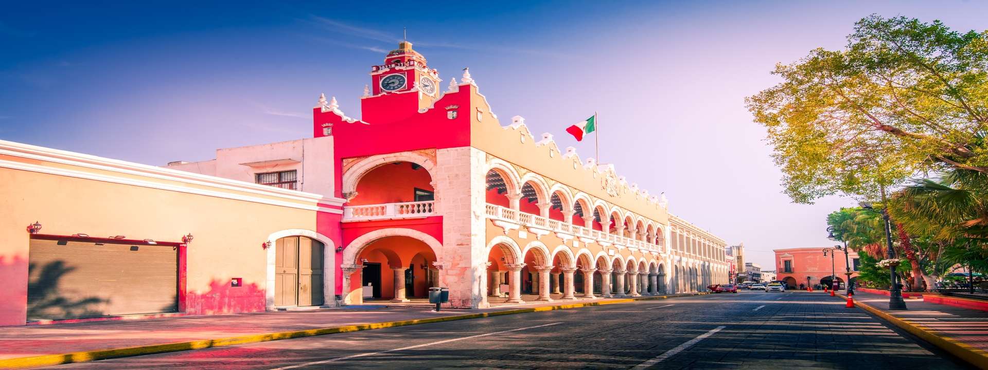 Main street in Mérida on a sunny day, perfect for enjoying the scenery and colonial architecture.